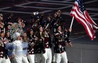Nordic combined skier Todd Lodwick leads the U.S. Olympic team into the stadium during the opening ceremony. (GEPA/Andreas Pranter)