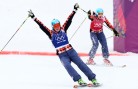 Marielle Thompson, left, and Kelsey Serwa celebrate gold and silver in ski cross on Friday. (GEPA/Daniel Goetzhaber)