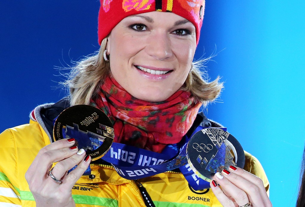 Maria Hoefl-Riesch poses with her two Olympic medals in Sochi. GEPA/Mario Kneisl