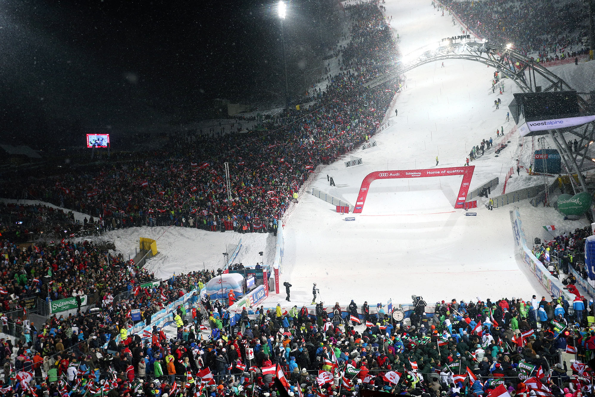 Fans and partygoers line the hill in Schladming
